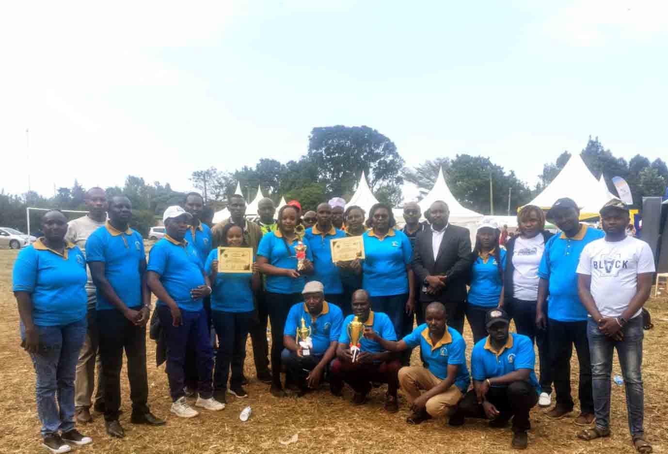 SACCO members proudly display the award
